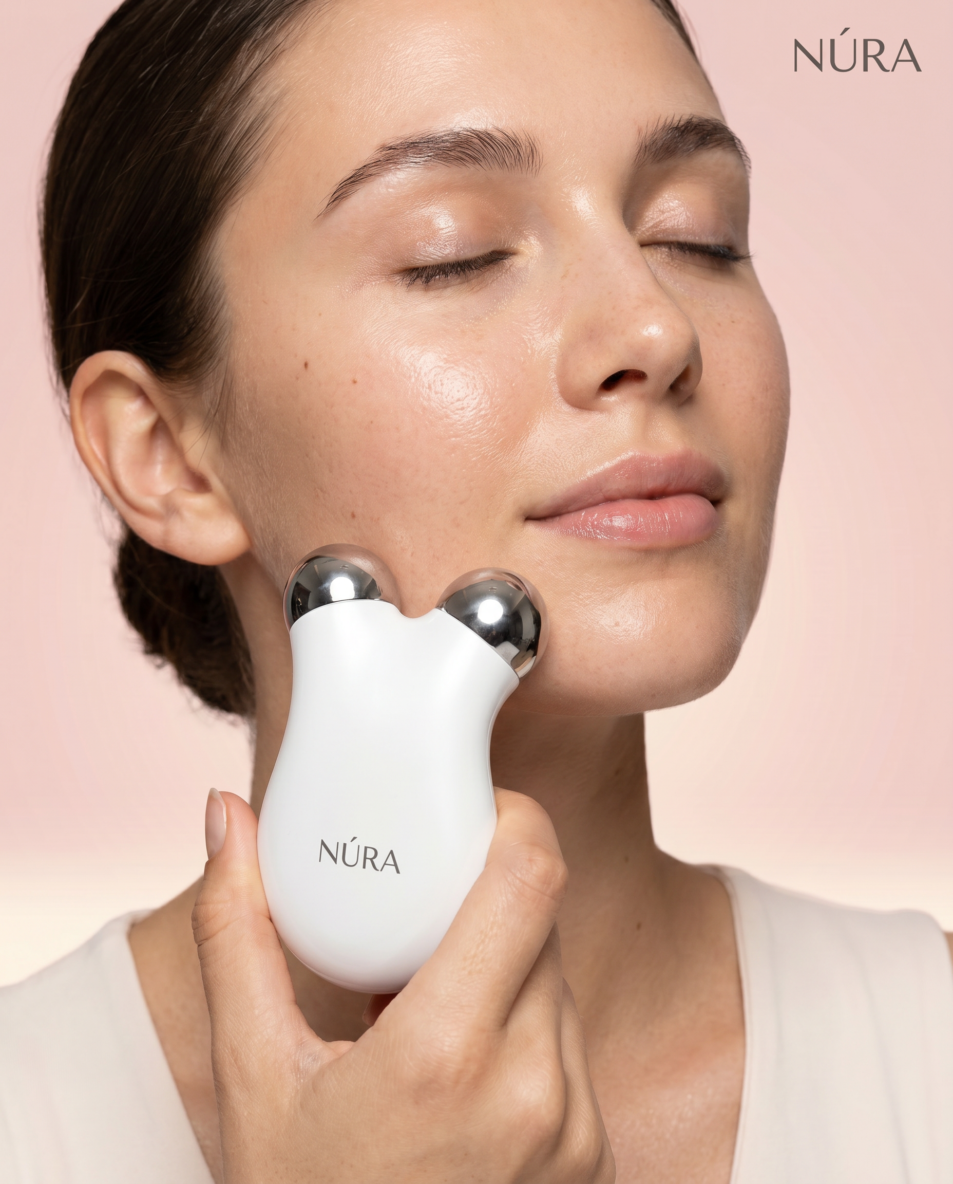 NÚRA Glow Lift™ — מכשיר עיסוי פנים Microcurrent